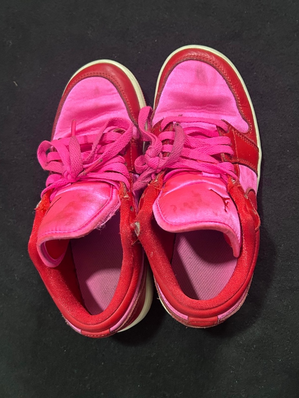 Red and hot pink nike low tops